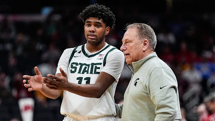 Michigan State guard Jase Richardson (11) talks to head coach Tom Izzo before a play against Wisconsin during the first half of Big Ten Tournament semifinal at Gainbridge Fieldhouse in Indianapolis, Ind. on Saturday, March 15, 2025.