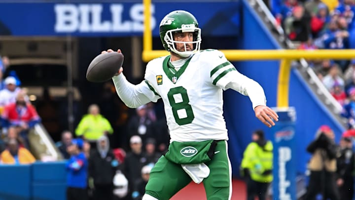 Dec 29, 2024; Orchard Park, New York, USA; New York Jets quarterback Aaron Rodgers (8) throws a pass in the first quarter against the Buffalo Bills at Highmark Stadium. Mandatory Credit: Mark Konezny-Imagn Images