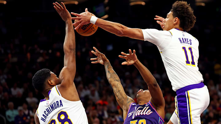 Feb 25, 2024; Phoenix, Arizona, USA; Phoenix Suns guard Saben Lee (38) shoots the ball against Los Angeles Lakers forward Rui Hachimura (28) and center Jaxson Hayes (11) during the first quarter at Footprint Center. Mandatory Credit: Mark J. Rebilas-Imagn Images