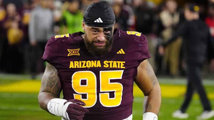 Arizona State defensive lineman Justin Wodtly (95) cries as he takes the field during a senior night ceremony before a game against Arizona at Mountain America Stadium in Tempe, Ariz. on Nov. 28, 2025. Arizona State defensive lineman Justin Wodtly (95) cries as he takes the field during a senior night ceremony before a game against Arizona at Mountain America Stadium in Tempe, Ariz. on Nov. 28, 2025.