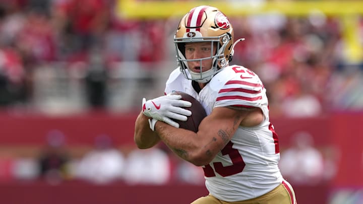 Sep 28, 2025; Santa Clara, California, USA; San Francisco 49ers running back Christian McCaffrey (23) carries the ball against the Jacksonville Jaguars during the second quarter at Levi's Stadium. Mandatory Credit: Darren Yamashita-Imagn Images
