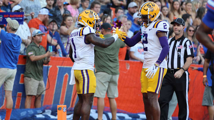 Nov 16, 2024; Gainesville, Florida, USA; LSU Tigers wide receiver Aaron Anderson (1) celebrates with wide receiver Kyren Lacy (2) after he scored a touchdown against the Florida Gators during the first half at Ben Hill Griffin Stadium. Mandatory Credit: Kim Klement Neitzel-Imagn Images Nov 16, 2024; Gainesville, Florida, USA; LSU Tigers wide receiver Aaron Anderson (1) celebrates with wide receiver Kyren Lacy (2) after he scored a touchdown against the Florida Gators during the first half at Ben Hill Griffin Stadium. Mandatory Credit: Kim Klement Neitzel-Imagn Images