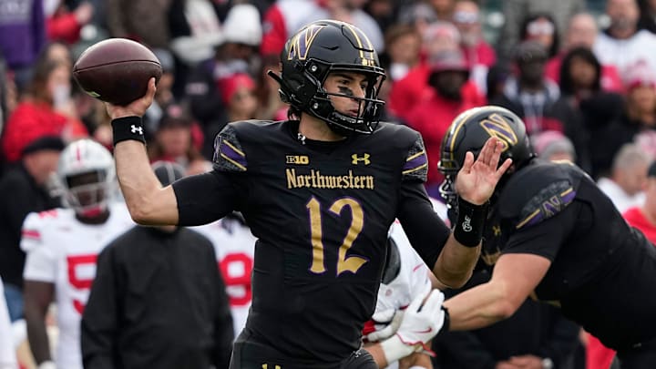 Northwestern Wildcats quarterback Jack Lausch (12) throws during the second half of the NCAA football game against the Ohio State Buckeyes at Wrigley Field in Chicago on Saturday, Nov. 16, 2024. Ohio State won 31-7.