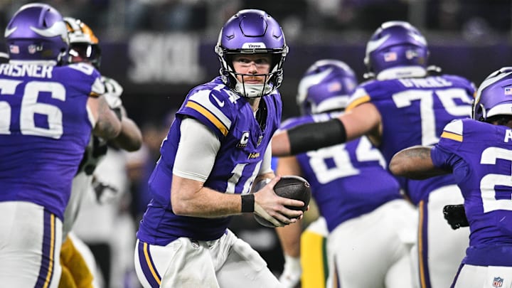 Dec 29, 2024; Minneapolis, Minnesota, USA; Minnesota Vikings quarterback Sam Darnold (14) looks to hand the ball off against the Green Bay Packers at U.S. Bank Stadium. Mandatory Credit: Jeffrey Becker-Imagn Images