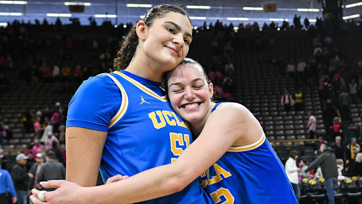 Feb 23, 2025; Iowa City, Iowa, USA; UCLA Bruins center Lauren Betts (51) and forward Angela Dugalic (32) react after the game against the Iowa Hawkeyes at Carver-Hawkeye Arena. Mandatory Credit: Jeffrey Becker-Imagn Images