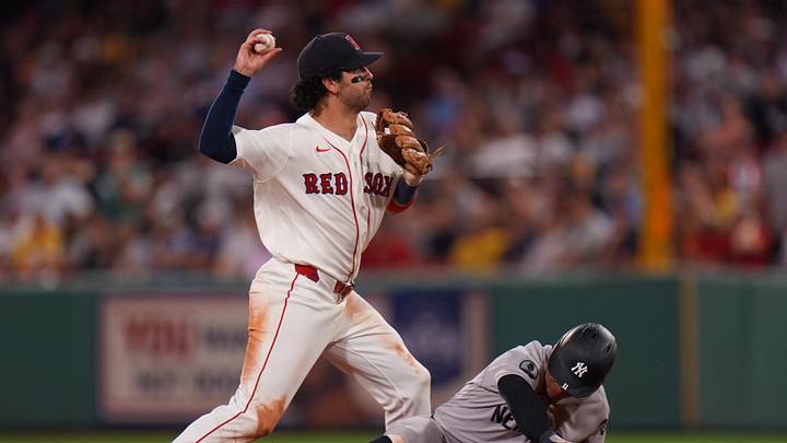 Jun 25, 2026; Boston, Massachusetts, USA; Boston Red Sox shortstop Marcelo Mayer (11) makes the out at second base against New York Yankees shortstop Anthony Volpe (11) in the ninth inning at Fenway Park. Mandatory Credit: David Butler II-Imagn Images