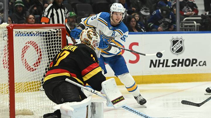 Mar 21, 2026; Vancouver, British Columbia, CAN; St. Louis Blues left wing Jake Neighbours (63) shoots the puck defended by Vancouver Canucks goaltender Kevin Lankinen (32) during the third period at Rogers Arena. Mandatory Credit: Simon Fearn-Imagn Images Mar 21, 2026; Vancouver, British Columbia, CAN; St. Louis Blues left wing Jake Neighbours (63) shoots the puck defended by Vancouver Canucks goaltender Kevin Lankinen (32) during the third period at Rogers Arena. Mandatory Credit: Simon Fearn-Imagn Images