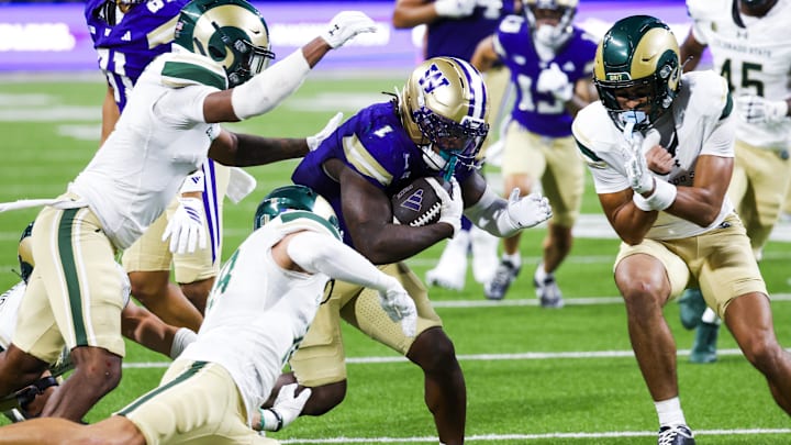 Aug 30, 2025; Seattle, Washington, USA; Washington Huskies running back Jonah Coleman (1) rushes against the Colorado State Rams during the fourth quarter at Husky Stadium. Mandatory Credit: Joe Nicholson-Imagn Images