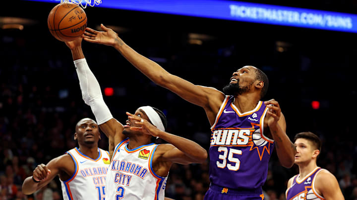 Mar 3, 2024; Phoenix, Arizona, USA; Oklahoma City Thunder guard Shai Gilgeous-Alexander (2) and Phoenix Suns forward Kevin Durant (35) go for a rebound during the second quarter at Footprint Center. Mandatory Credit: Mark J. Rebilas-Imagn Images Mar 3, 2024; Phoenix, Arizona, USA; Oklahoma City Thunder guard Shai Gilgeous-Alexander (2) and Phoenix Suns forward Kevin Durant (35) go for a rebound during the second quarter at Footprint Center. Mandatory Credit: Mark J. Rebilas-Imagn Images