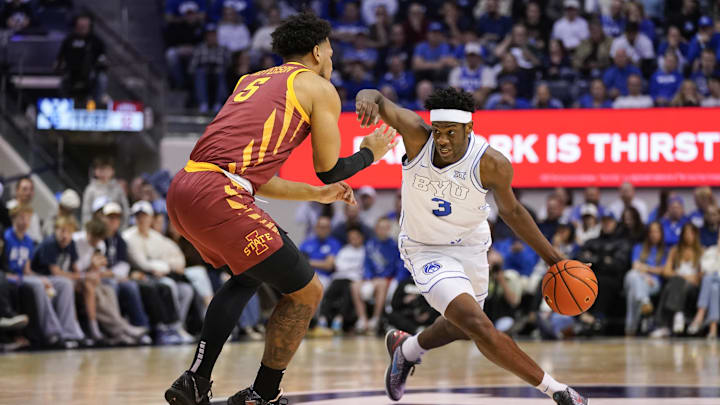 Feb 21, 2026; Provo, Utah, USA; BYU Cougars forward AJ Dybantsa (3) drives while being defended by Iowa State Cyclones forward Joshua Jefferson (5) during the first half at Marriott Center. Mandatory Credit: Aaron Baker-Imagn Images