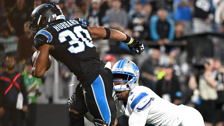 Carolina Panthers running back Chuba Hubbard (30) carries the ball defended by Detroit Lions cornerback D.J. Reed (4) 