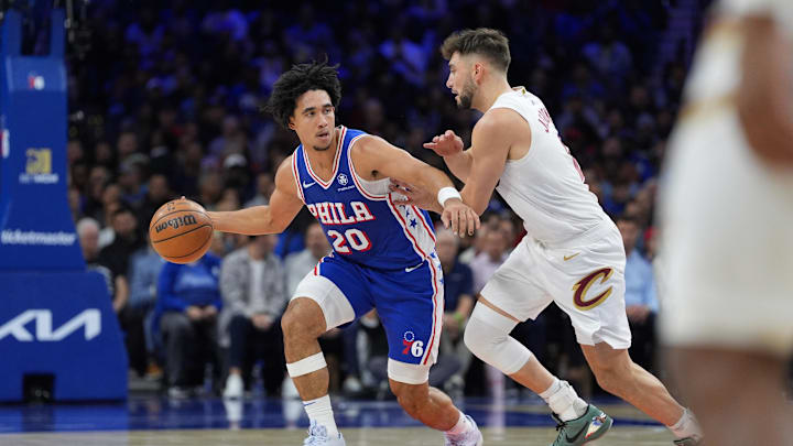 Nov 13, 2024; Philadelphia, Pennsylvania, USA; Philadelphia 76ers guard Jared McCain (20) drives against Cleveland Cavaliers guard Ty Jerome (2) in the second quarter at Wells Fargo Center. Mandatory Credit: Kyle Ross-Imagn Images