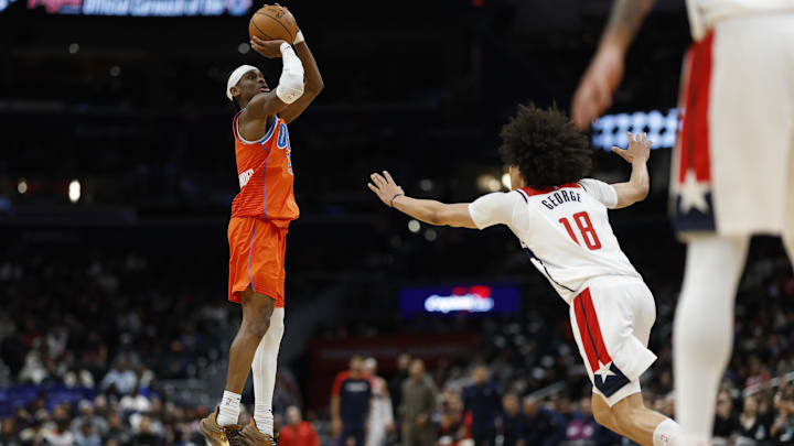 Jan 12, 2025; Washington, District of Columbia, USA; Oklahoma City Thunder guard Shai Gilgeous-Alexander (2) shoots the ball as Washington Wizards forward Kyshawn George (18) defends in the fourth quarter at Capital One Arena. Mandatory Credit: Geoff Burke-Imagn Images