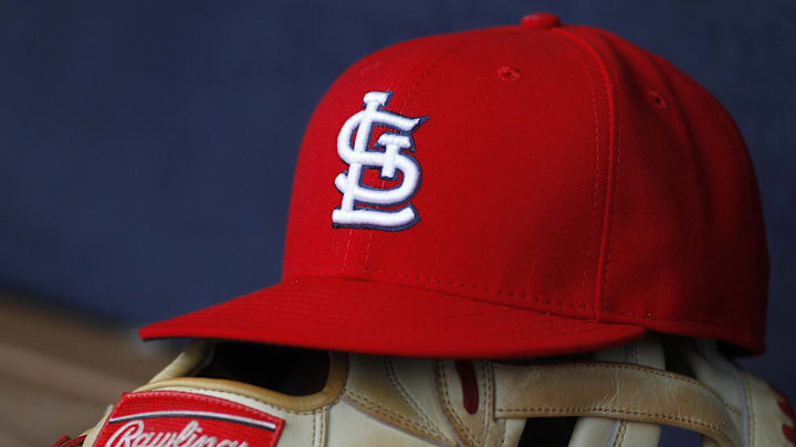 Oct 4, 2015; Atlanta, GA, USA; Detailed view of St. Louis Cardinals hat and glove in the dugout against the Atlanta Braves in the ninth inning at Turner Field. The Braves defeated the Cardinals 2-0. Mandatory Credit: Brett Davis-Imagn Images Oct 4, 2015; Atlanta, GA, USA; Detailed view of St. Louis Cardinals hat and glove in the dugout against the Atlanta Braves in the ninth inning at Turner Field. The Braves defeated the Cardinals 2-0. Mandatory Credit: Brett Davis-Imagn Images