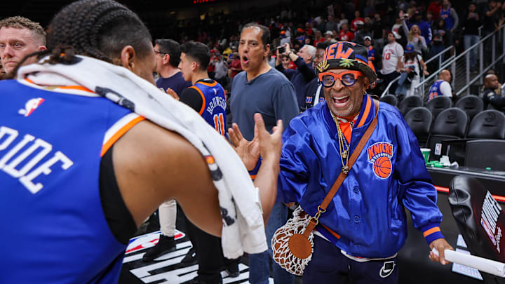 Apr 30, 2026; Atlanta, Georgia, USA; New York Knicks fan Spike Lee celebrates with guard Miles McBride (2) after a victory over the Atlanta Hawks during game six of the first round of the 2026 NBA Playoffs at State Farm Arena. Mandatory Credit: Brett Davis-Imagn Images