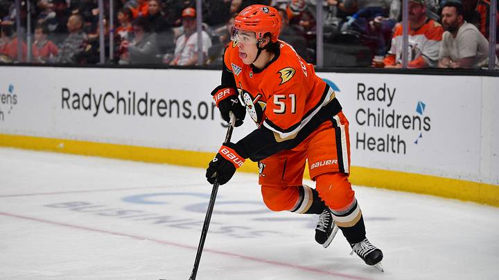 Mar 22, 2026; Anaheim, California, USA; Anaheim Ducks defenseman Olen Zellweger (51) moves the puck against the Buffalo Sabres during the first period at Honda Center. Mandatory Credit: Gary A. Vasquez-Imagn Images