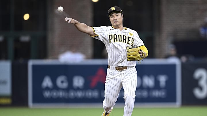 Aug 13, 2024; San Diego, California, USA; San Diego Padres shortstop Ha-Seong Kim (7) throws to first base against the Pittsburgh Pirates during the third inning at Petco Park. Mandatory Credit: Orlando Ramirez-Imagn Images