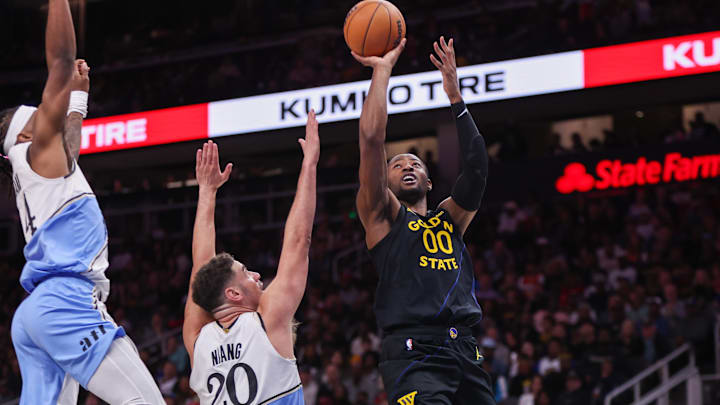 Mar 22, 2025; Atlanta, Georgia, USA; Golden State Warriors forward Jonathan Kuminga (00) shoots against the Atlanta Hawks in the third quarter at State Farm Arena. Mandatory Credit: Brett Davis-Imagn Images
