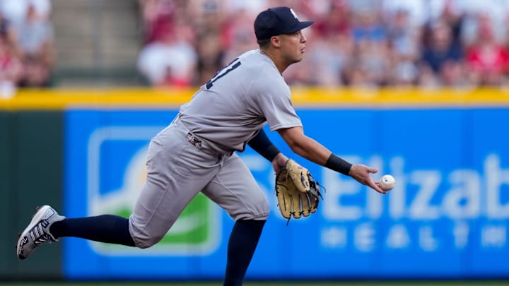 New York Yankees shortstop Anthony Volpe (11) plays a ground ball off the bat of Cincinnati Reds designated hitter Tyler Stephenson (37) in the second inning of the MLB interleague game between the Cincinnati Reds and the New York Yankees at Great American Ball Park in downtown Cincinnati on Monday, June 23, 2025.