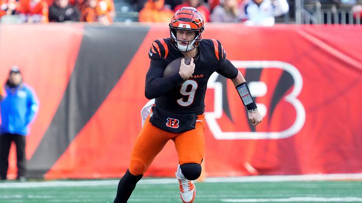 Cincinnati Bengals quarterback Joe Burrow (9) runs for a first down in the second quarter of the NFL Week 16 game between the Cincinnati Bengals and the Cleveland Browns at Paycor Stadium in downtown Cincinnati on Sunday, Dec. 22, 2024. The Bengals led 17-0 at halftime.