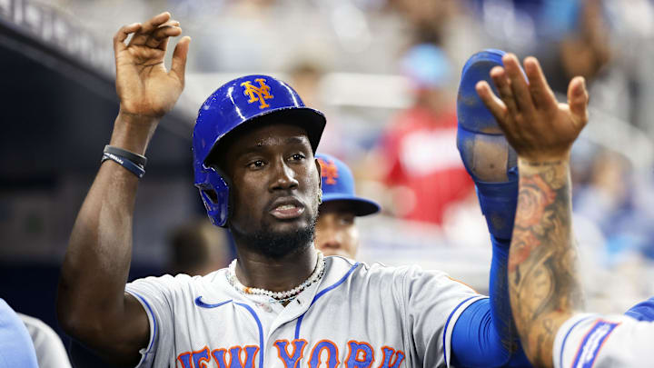 Sep 18, 2023; Miami, Florida, USA; New York Mets shortstop Ronny Mauricio (10) celebrates scoring in the dugout against the Miami Marlins during the fifth inning at loanDepot Park. Mandatory Credit: Rhona Wise-Imagn Images