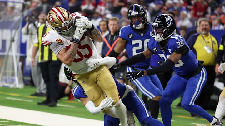 Dec 22, 2025; Indianapolis, Indiana, USA; Indianapolis Colts safety Cam Bynum (0) tackles San Francisco 49ers tight end George Kittle (85) in the third quarter of the game at Lucas Oil Stadium. Mandatory Credit: Trevor Ruszkowski-Imagn Images Dec 22, 2025; Indianapolis, Indiana, USA; Indianapolis Colts safety Cam Bynum (0) tackles San Francisco 49ers tight end George Kittle (85) in the third quarter of the game at Lucas Oil Stadium. Mandatory Credit: Trevor Ruszkowski-Imagn Images