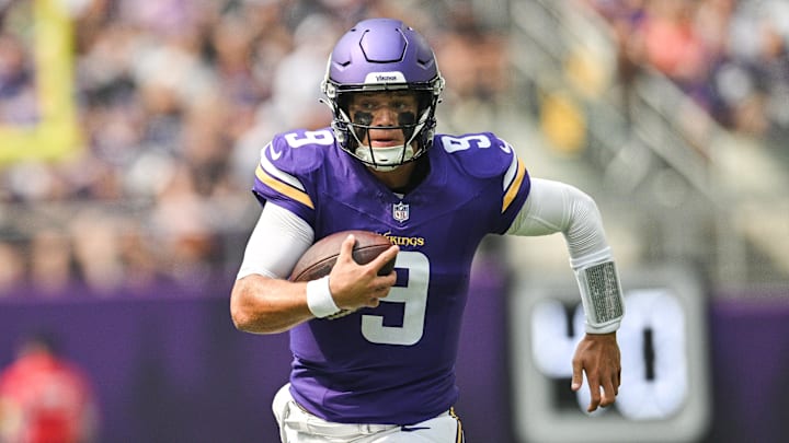 Minnesota Vikings quarterback J.J. McCarthy (9) scrambles for a gain against the Houston Texans during the first quarter at U.S. Bank Stadium. 