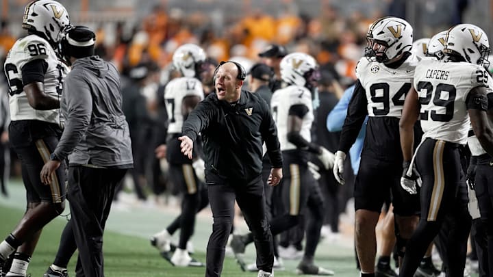 Vanderbilt coach Clark Lea congratulates defensive players after they made a third down stop against Tennessee during the third quarter at Neyland Stadium in Knoxville, Tenn., Saturday, Nov. 29, 2025. Vanderbilt coach Clark Lea congratulates defensive players after they made a third down stop against Tennessee during the third quarter at Neyland Stadium in Knoxville, Tenn., Saturday, Nov. 29, 2025.