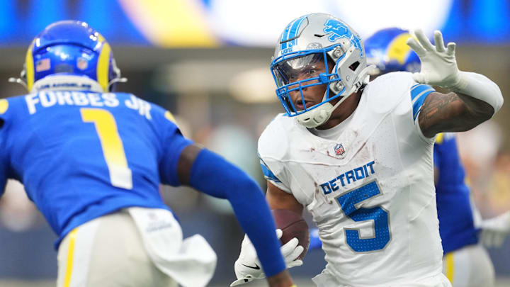 Dec 14, 2025; Inglewood, California, USA; Detroit Lions running back David Montgomery (5) runs the ball against Los Angeles Rams cornerback Emmanuel Forbes Jr. (1) during the second quarter at SoFi Stadium. Mandatory Credit: Kirby Lee-Imagn Images Dec 14, 2025; Inglewood, California, USA; Detroit Lions running back David Montgomery (5) runs the ball against Los Angeles Rams cornerback Emmanuel Forbes Jr. (1) during the second quarter at SoFi Stadium. Mandatory Credit: Kirby Lee-Imagn Images