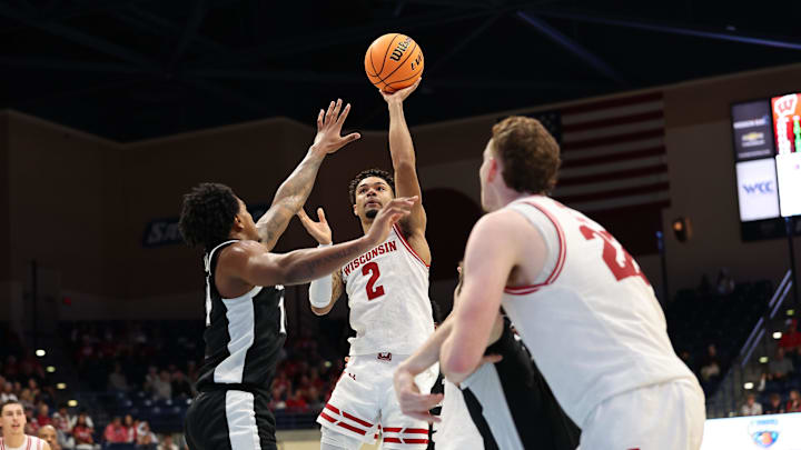 Nov 27, 2025; San Diego, CA, USA; Wisconsin Badgers guard Nick Boyd (2) shoots the ball against the Providence Friars during the second half at Jenny Craig Pavilion.