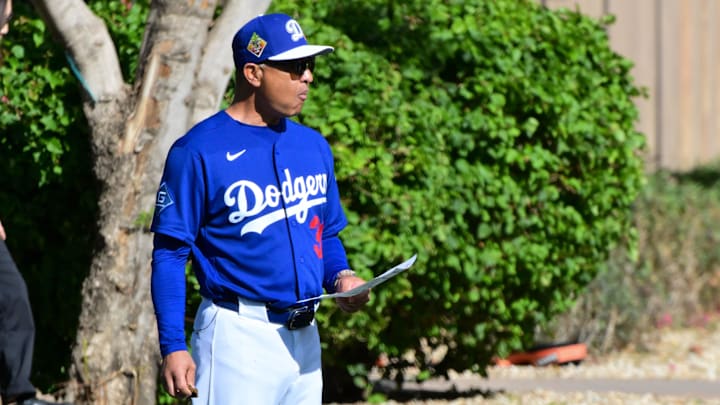 Feb 17, 2026; Glendale, AZ, USA; Los Angeles Dodgers manager Dave Roberts (30) looks on during a Spring Training workout at Camelback Ranch. Mandatory Credit: Matt Kartozian-Imagn Images