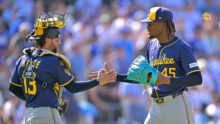 Milwaukee Brewers players Eric Haase and Abner Uribe celebrate against the Los Angeles Dodgers.