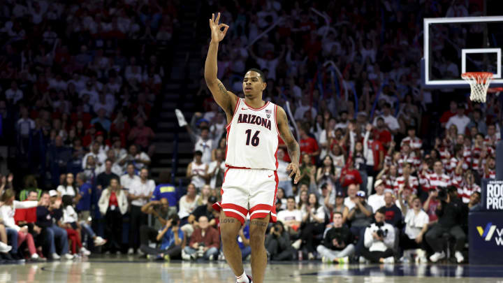 Mar 2, 2024; Tucson, Arizona, USA; Arizona Wildcats forward Keshad Johnson (16) celebrates a three point basket at center court against the Oregon Ducks during the second half at McKale Center. Mandatory Credit: Zachary BonDurant-USA TODAY Sports
