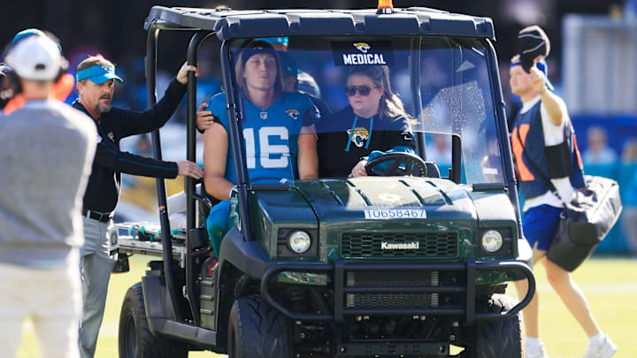 Jacksonville Jaguars quarterback Trevor Lawrence (16) is carted off the field after sustaining a heavy hit during the second quarter of an NFL football matchup Sunday, Dec. 1, 2024 at EverBank Stadium in Jacksonville, Fla. [Corey Perrine/Florida Times-Union]