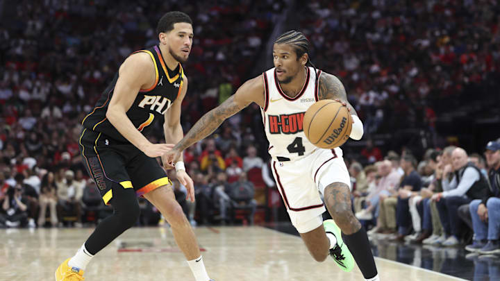 Mar 12, 2025; Houston, Texas, USA; Houston Rockets guard Jalen Green (4) dribbles the ball as Phoenix Suns guard Devin Booker (1) defends during the third quarter at Toyota Center. Mandatory Credit: Troy Taormina-Imagn Images Mar 12, 2025; Houston, Texas, USA; Houston Rockets guard Jalen Green (4) dribbles the ball as Phoenix Suns guard Devin Booker (1) defends during the third quarter at Toyota Center. Mandatory Credit: Troy Taormina-Imagn Images