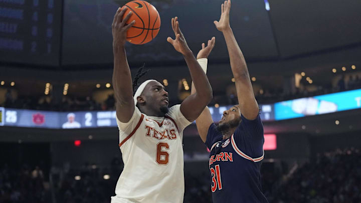 Jan 7, 2025; Austin, Texas, USA; Texas Longhorns forward Arthur Kaluma (6) shoots over Auburn Tigers forward Chaney Johnson (31) during the first half at Moody Center. Mandatory Credit: Scott Wachter-Imagn Images
