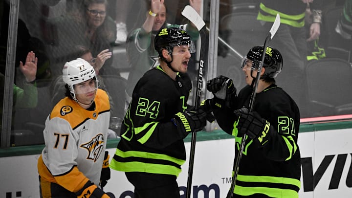 Apr 3, 2025; Dallas, Texas, USA; Dallas Stars center Roope Hintz (24) and left wing Jason Robertson (21) celebrates a goal scored by Hintz against the Nashville Predators during the third period at the American Airlines Center. Mandatory Credit: Jerome Miron-Imagn Images