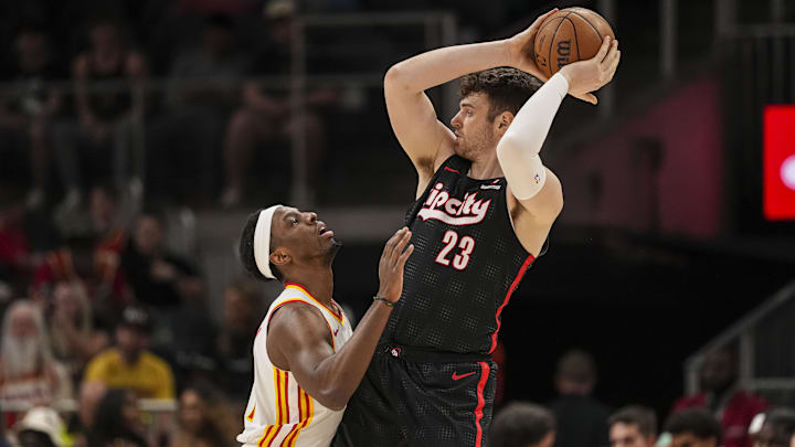 Apr 1, 2025; Atlanta, Georgia, USA; Portland Trail Blazers center Donovan Clingan (23) protects the ball from Atlanta Hawks forward Onyeka Okongwu (17) during the first half at State Farm Arena. Mandatory Credit: Dale Zanine-Imagn Images Apr 1, 2025; Atlanta, Georgia, USA; Portland Trail Blazers center Donovan Clingan (23) protects the ball from Atlanta Hawks forward Onyeka Okongwu (17) during the first half at State Farm Arena. Mandatory Credit: Dale Zanine-Imagn Images