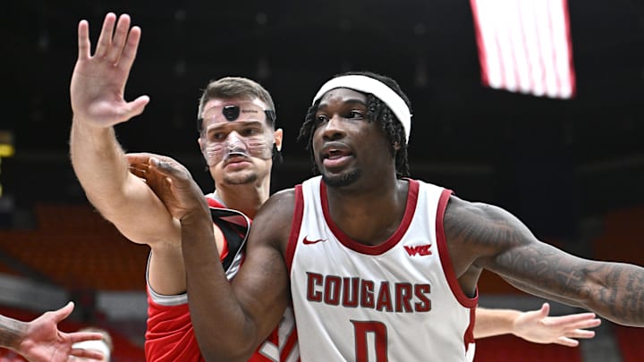 Oct 25, 2025; Pullman, WA, USA; Washington State Cougars forward Emmanuel Ugbo (0) fights for position against New Mexico Lobos forward Milos Vicentic (31) in the second half at Friel Court at Beasley Coliseum. Washington State Cougars won 74-66. Mandatory Credit: James Snook-Imagn Images Oct 25, 2025; Pullman, WA, USA; Washington State Cougars forward Emmanuel Ugbo (0) fights for position against New Mexico Lobos forward Milos Vicentic (31) in the second half at Friel Court at Beasley Coliseum. Washington State Cougars won 74-66. Mandatory Credit: James Snook-Imagn Images