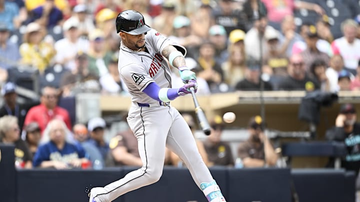 Sep 28, 2025; San Diego, California, USA; Arizona Diamondbacks second baseman Ketel Marte (4) hits a solo home run during the first inning against the San Diego Padres at Petco Park. Mandatory Credit: Denis Poroy-Imagn Images