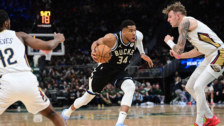 Apr 10, 2025; Milwaukee, Wisconsin, USA; Milwaukee Bucks forward Giannis Antetokounmpo (34) drives for the basket against New Orleans Pelicans center Kylor Kelley (35) in the third quarter at Fiserv Forum. Mandatory Credit: Benny Sieu-Imagn Images