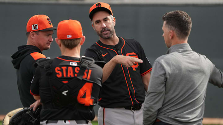 Feb 13, 2025; Scottsdale, AZ, USA; San Francisco Giants pitcher Justin Verlander (35) watches players work out in the bullpen during spring training camp.