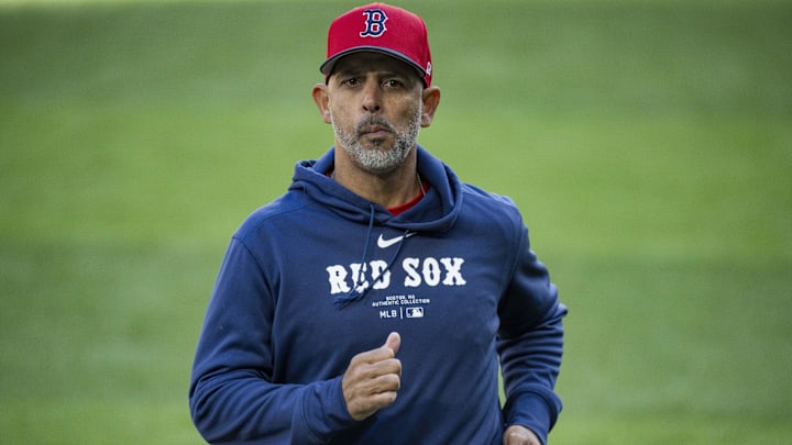 Boston Red Sox manager Alex Cora runs back to the dugout during the sixth inning against the Texas Rangers at Globe Life Field.
