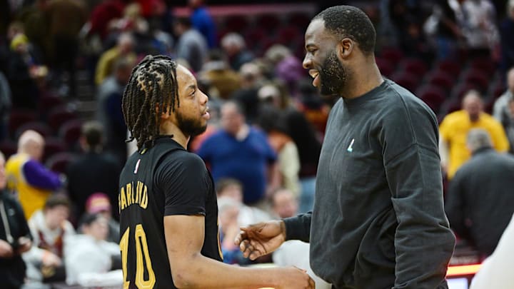 Jan 20, 2023; Cleveland, Ohio, USA; Cleveland Cavaliers guard Darius Garland (10) talks to Golden State Warriors forward Draymond Green after the game at Rocket Mortgage FieldHouse. Mandatory Credit: Ken Blaze-Imagn Images