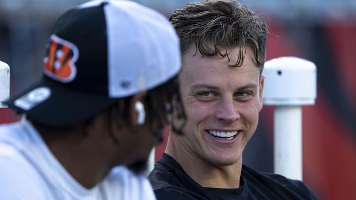 Sep 25, 2023; Cincinnati, Ohio, USA; Cincinnati Bengals quarterback Joe Burrow (9) smiles while speaking with Cincinnati Bengals wide receiver Ja'Marr Chase (1) before stretching for the NFL game between the Cincinnati Bengals and Los Angeles Rams at Paycor Stadium. Mandatory Credit: Albert Cesare-Imagn Images Sep 25, 2023; Cincinnati, Ohio, USA; Cincinnati Bengals quarterback Joe Burrow (9) smiles while speaking with Cincinnati Bengals wide receiver Ja'Marr Chase (1) before stretching for the NFL game between the Cincinnati Bengals and Los Angeles Rams at Paycor Stadium. Mandatory Credit: Albert Cesare-Imagn Images