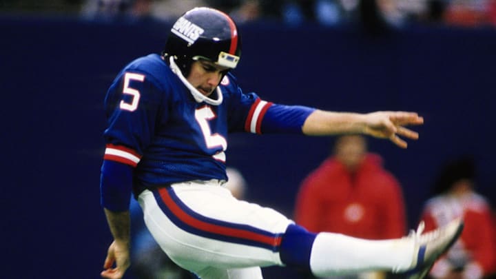 New York Giants punter Sean Landeta (5) follows through on a kick against the New York Giants at Giants Stadium. New York Giants punter Sean Landeta (5) follows through on a kick against the New York Giants at Giants Stadium.
