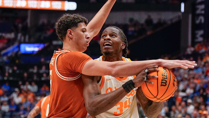 Texas forward Kadin Shedrick (5) pressures Tennessee forward Felix Okpara (34) during the first half of a Southeastern Conference tournament quarterfinal game at Bridgestone Arena.