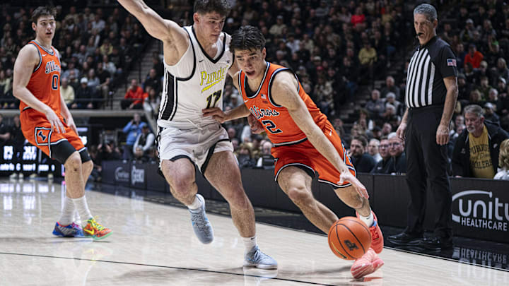 Jan 24, 2026; West Lafayette, Indiana, USA; Illinois Fighting Illini guard Andrej Stojakovic (2) dribbles around Purdue Boilermakers guard Omer Mayer (17) during the first half at Mackey Arena. Mandatory Credit: Jacob Musselman-Imagn Images