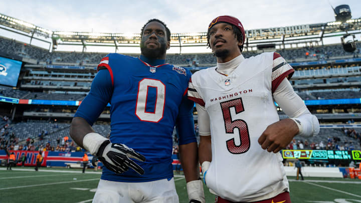 New York Giants linebacker Brian Burns (0) poses with Washington Commanders quarterback Jayden Daniels (5) after the game between the New York Giants and the Washington Commanders at MetLife Stadium in East Rutherford on Sunday, Nov. 3, 2024.
