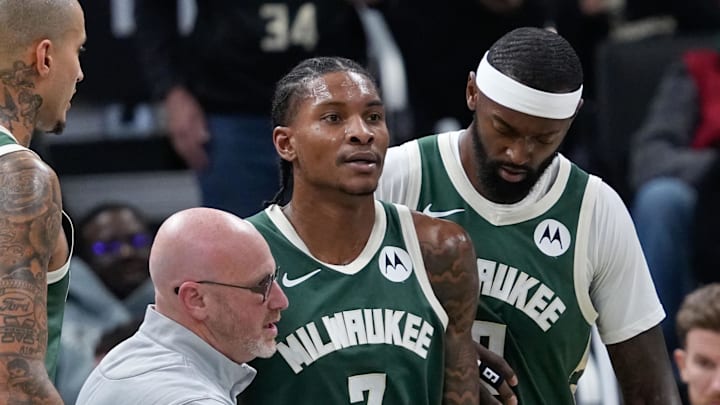 Oct 22, 2025; Milwaukee, Wisconsin, USA; Milwaukee Bucks guard Kevin Porter Jr. (7) is helped off the court after being injured in the first half against the Washington Wizards at Fiserv Forum. Mandatory Credit: Michael McLoone-Imagn Images